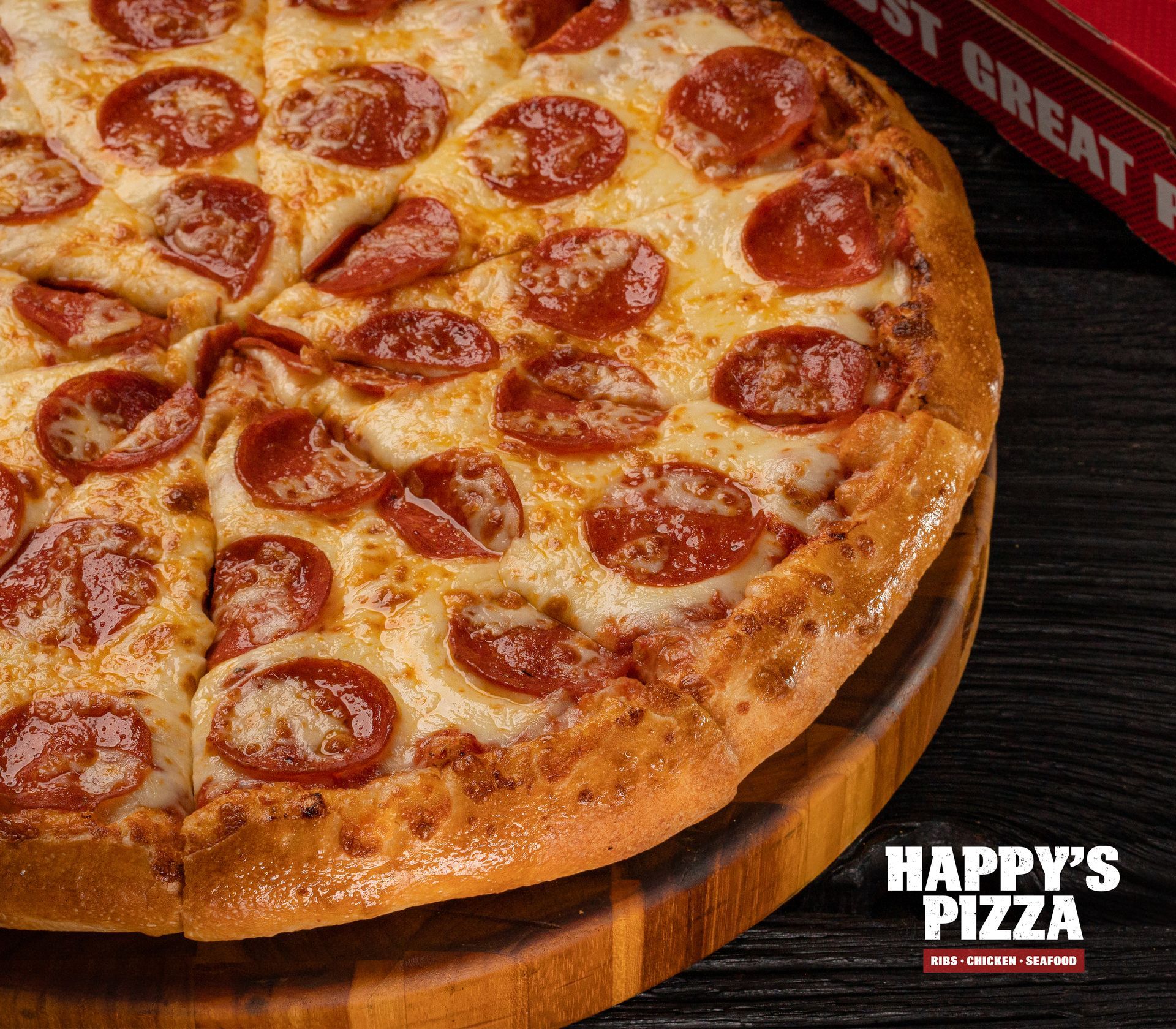 A pepperoni pizza from happy 's pizza on a wooden cutting board