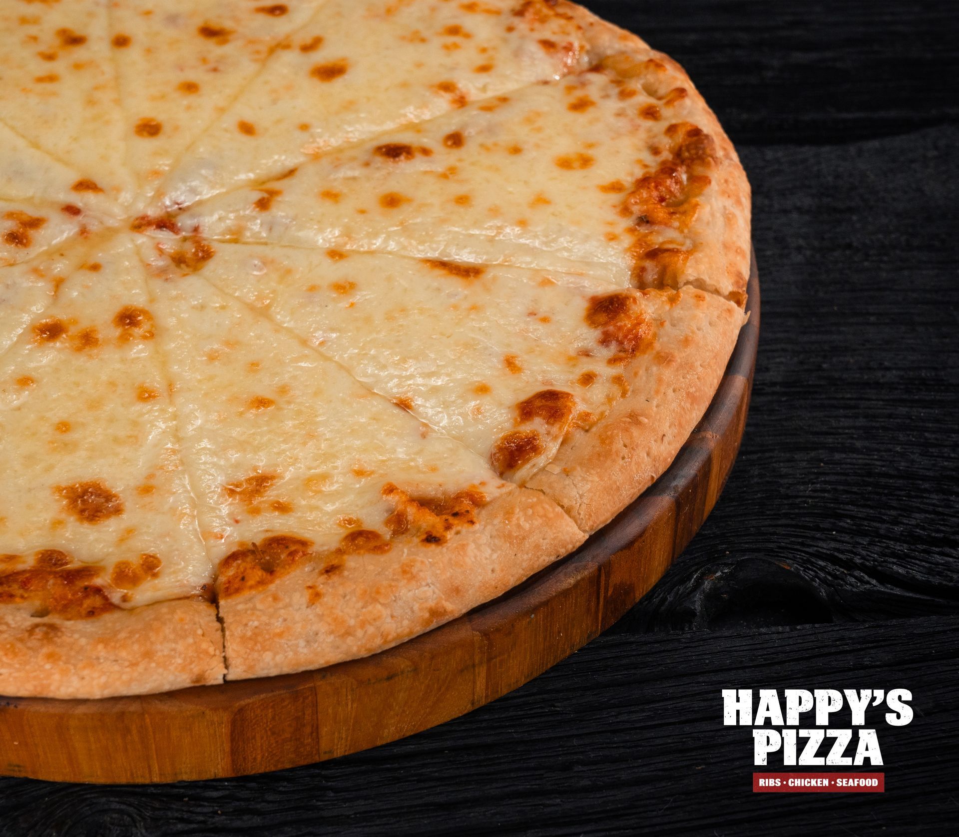 A cheese pizza is sitting on top of a wooden cutting board.