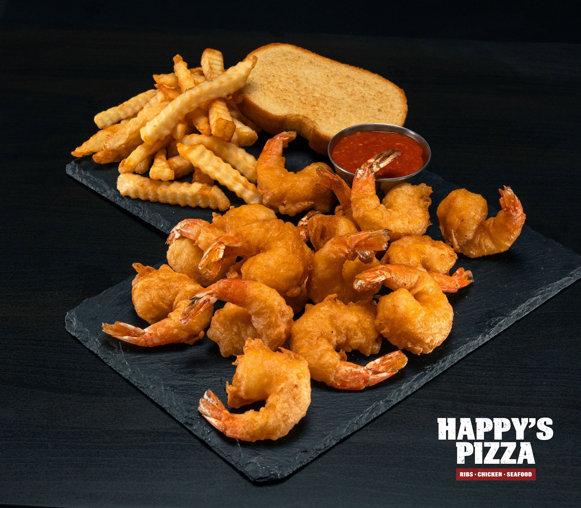 A tray of shrimp and french fries from happy 's pizza