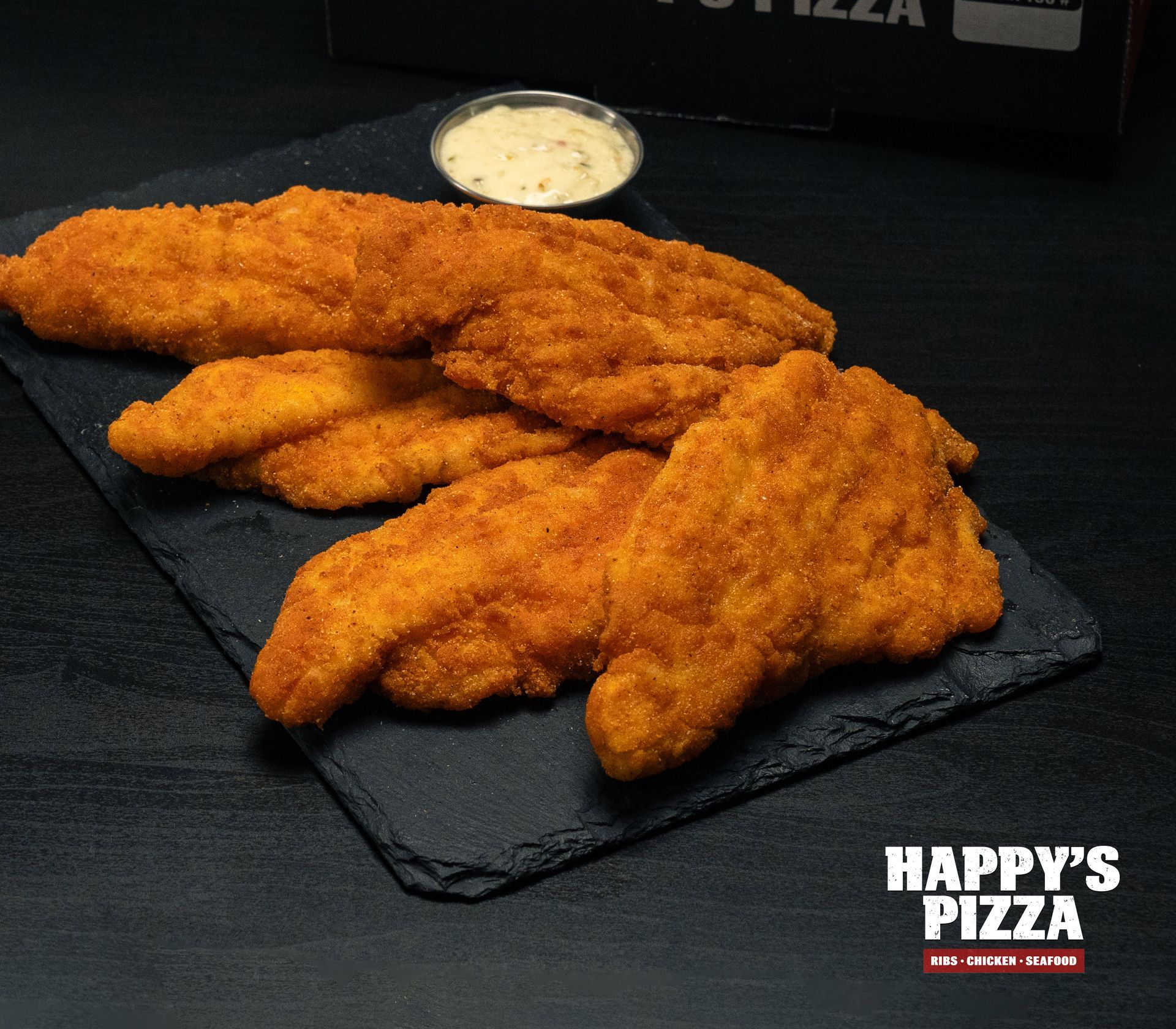 A tray of chicken fingers from happy 's pizza
