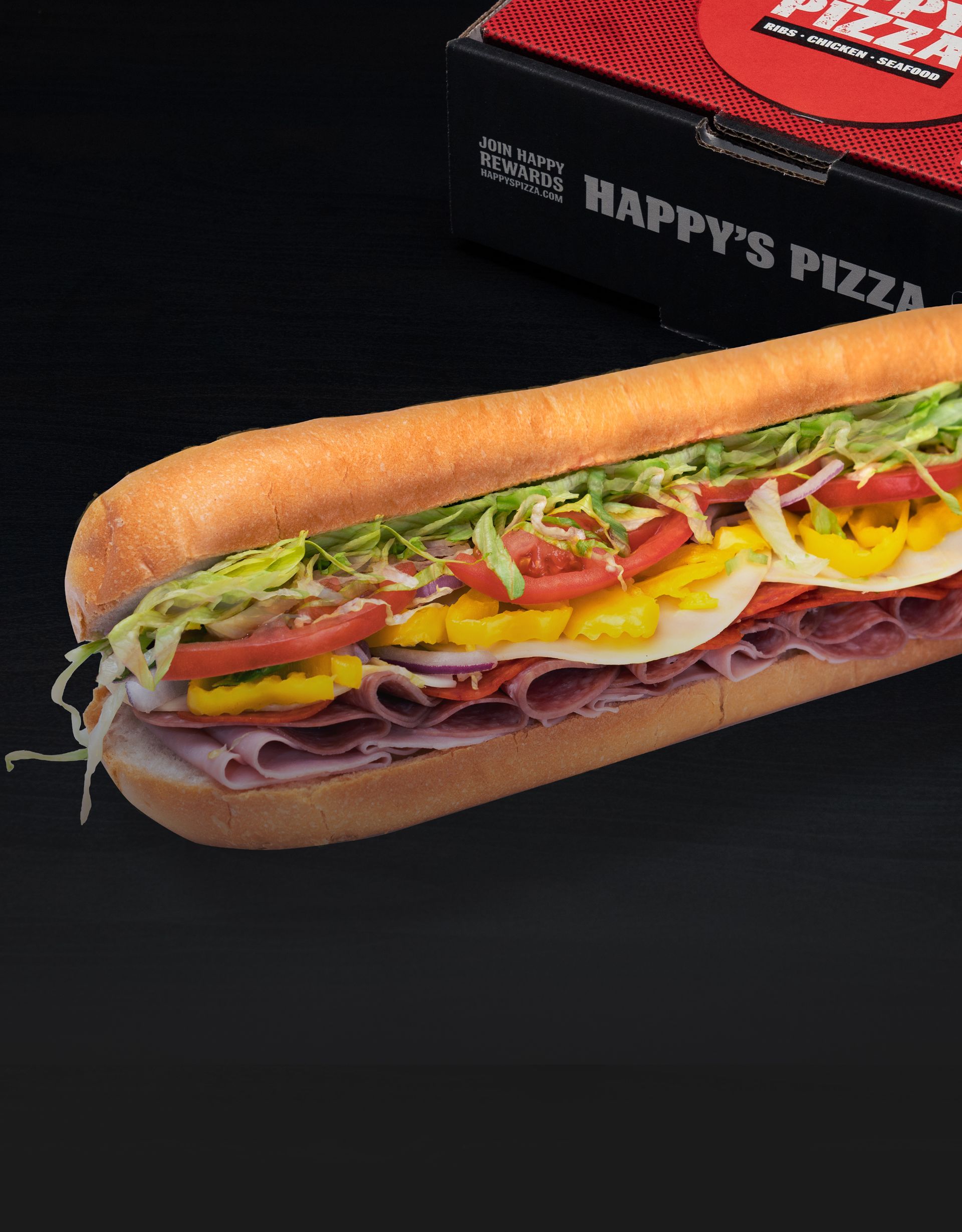 Italian sub loaded with deli meats, shredded lettuce, fresh vegetables, and Italian dressing.
