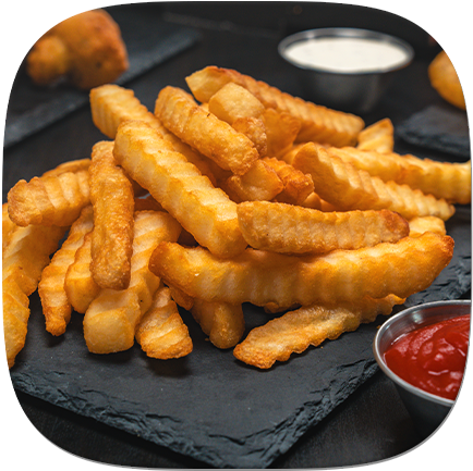 A plate of French fries with sides of ketchup and sour cream