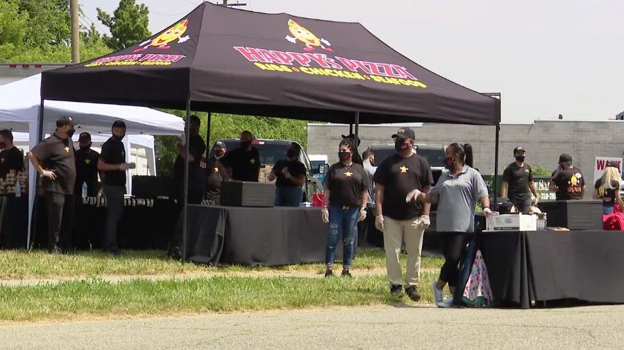 Kids in Detroit line up for free meals from Happy's Pizza