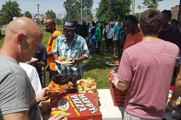 Fox 2 Detroit highlighting Happy's Pizza's community outreach at a local event