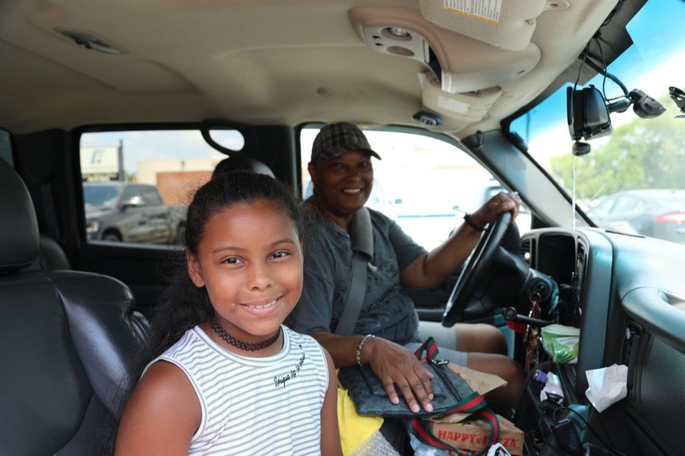 Smiling faces receive kids meals