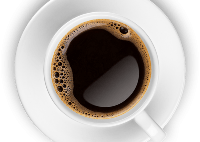 A cup of coffee on a saucer on a white background.