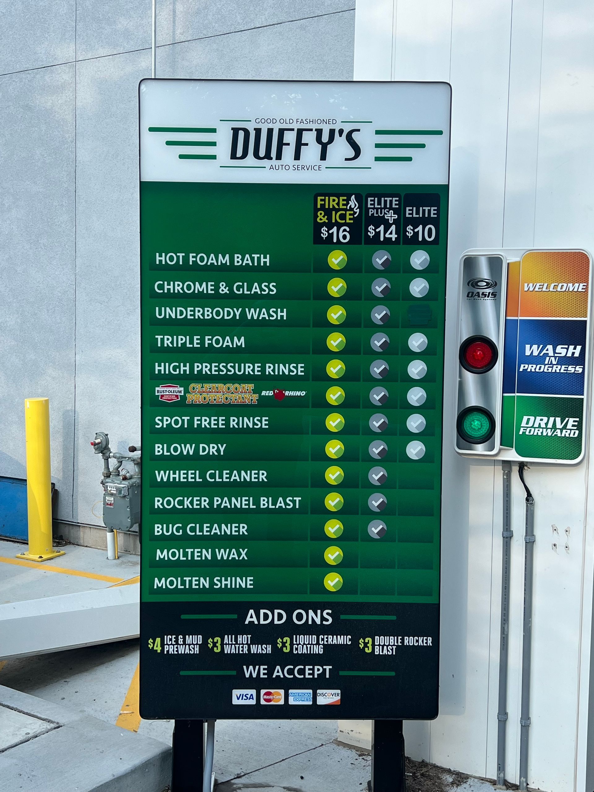 A green sign for duffy 's car wash | Duffy's Auto Service
