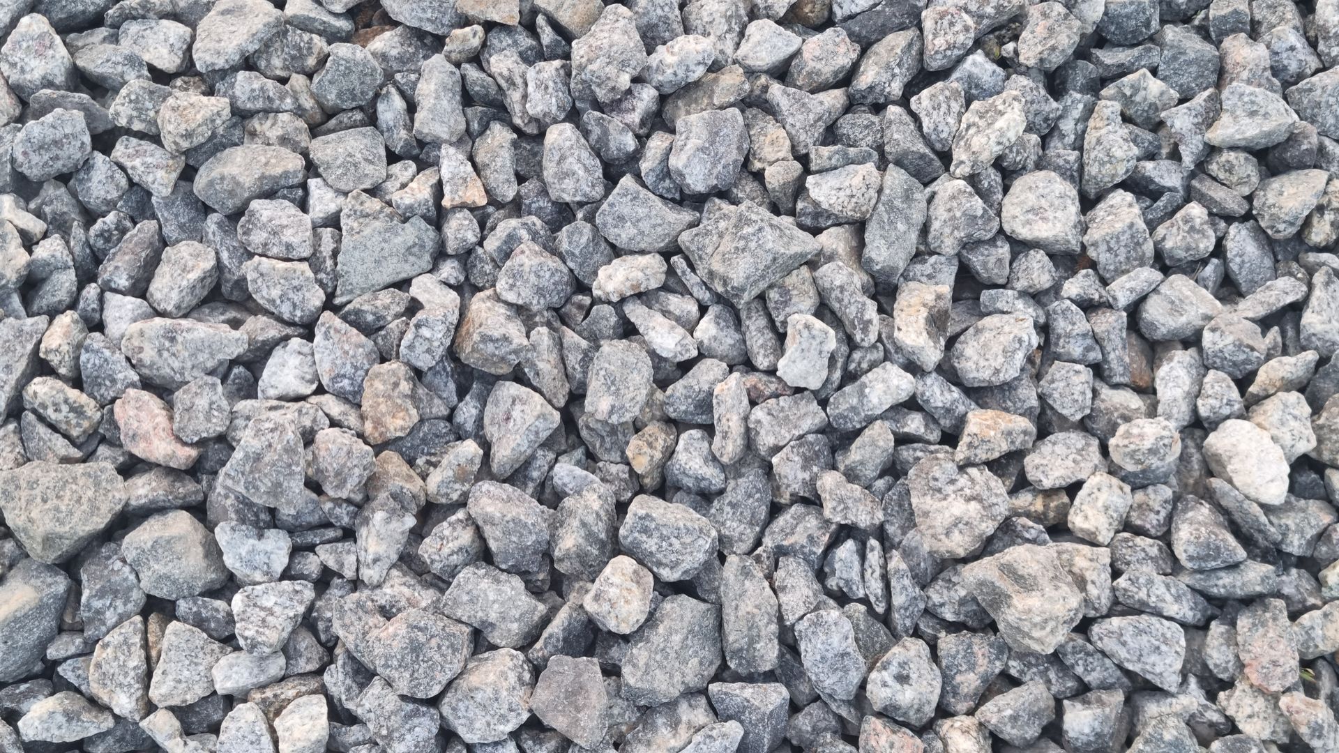 Pile of gray gravel stones filling the frame