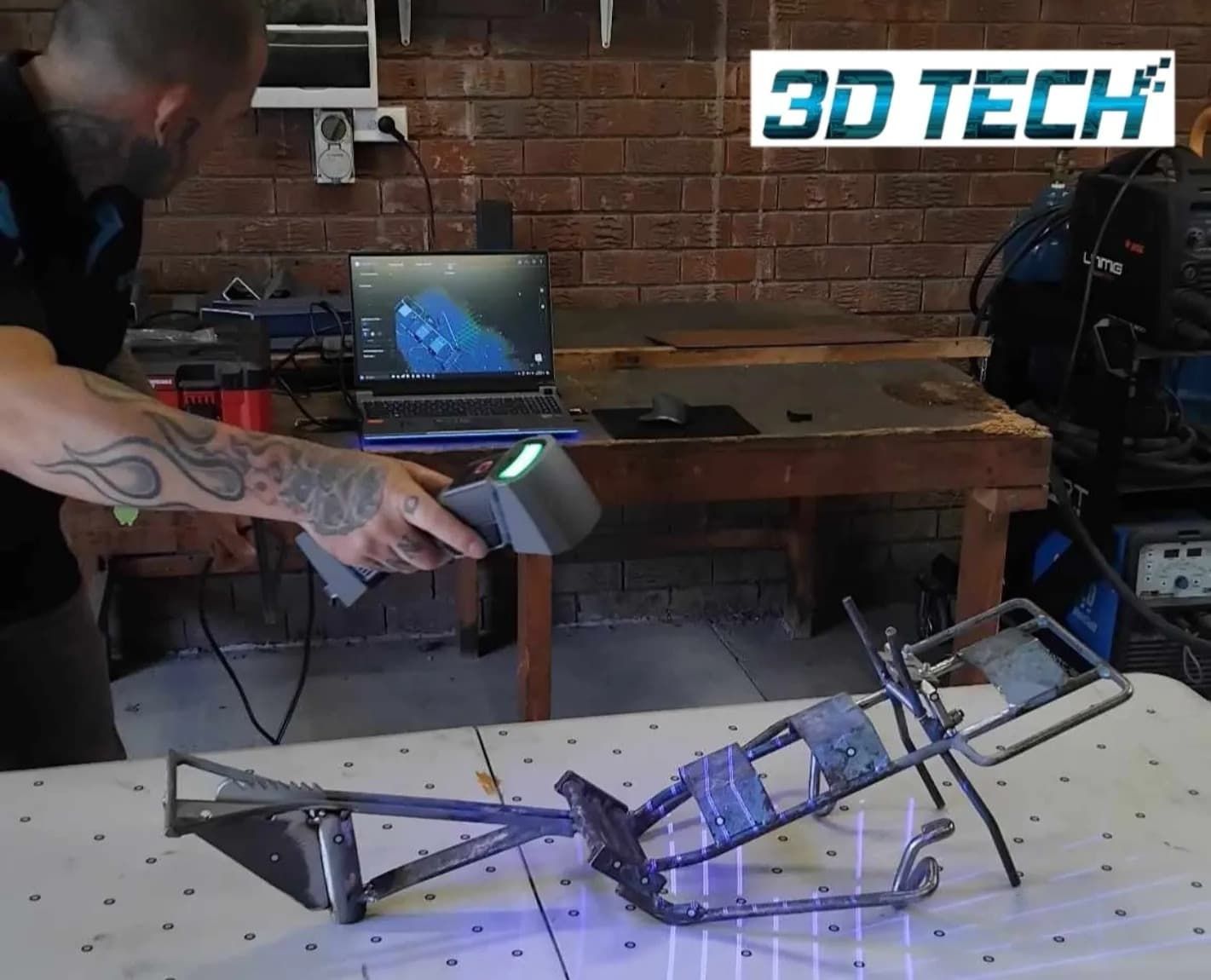 A Man is Using a 3d Tech Machine to Scan a Piece of Metal — 3D Tech In Sancrox, NSW