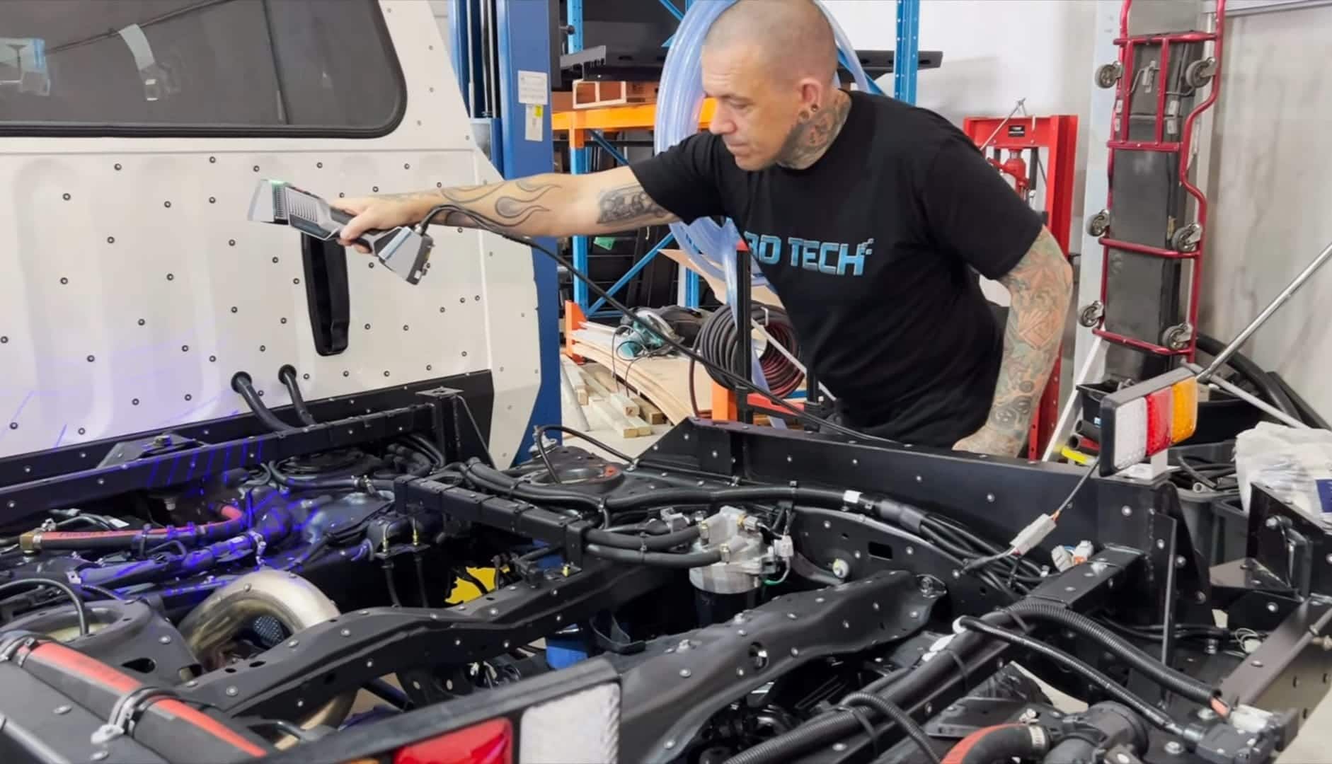 A Man is Working on the Engine of a Truck in a Garage — 3D Tech In Sancrox, NSW