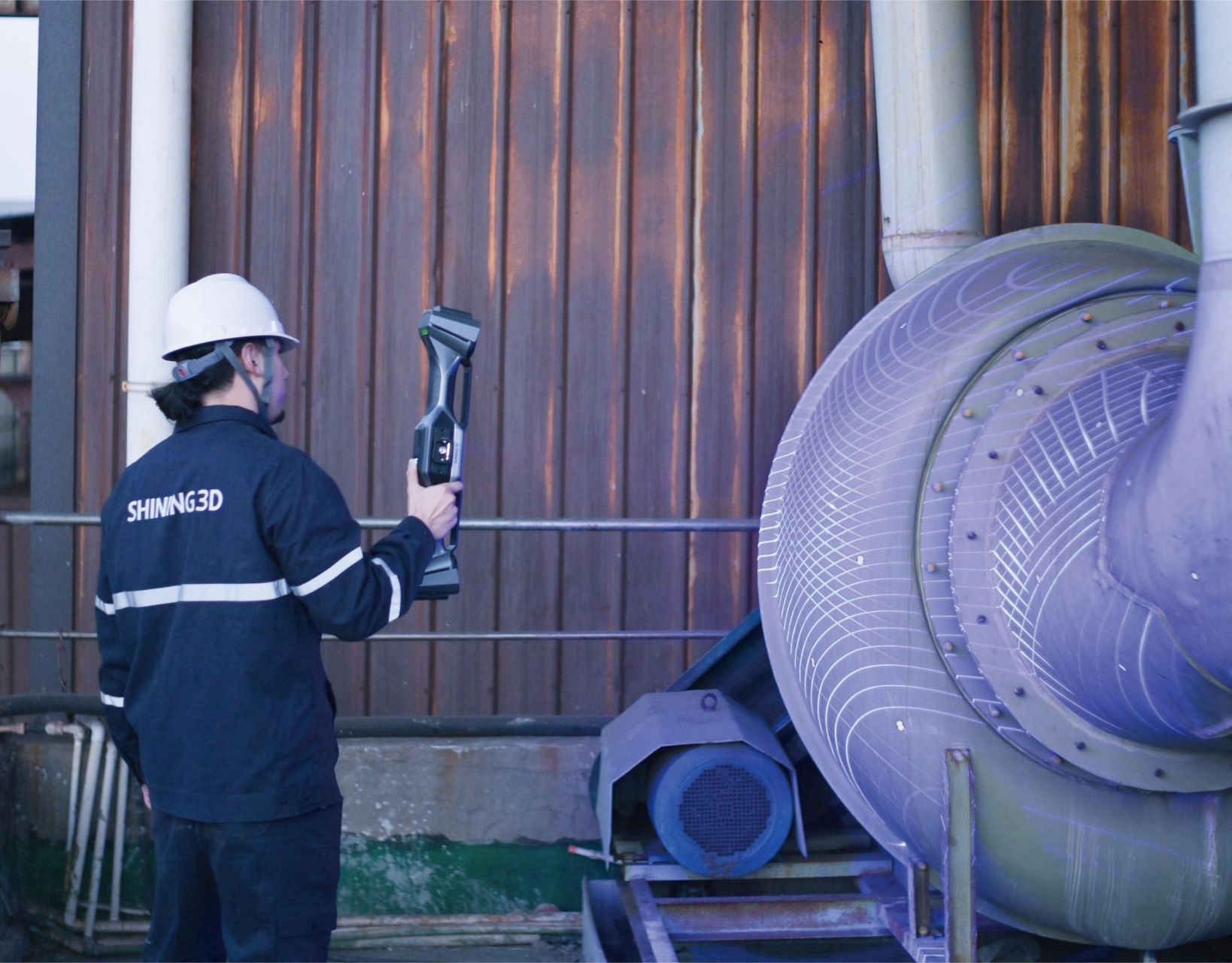 A man is holding a 3d scanner in front of a large purple object. — 3D Tech In Coffs Harbour, NSW