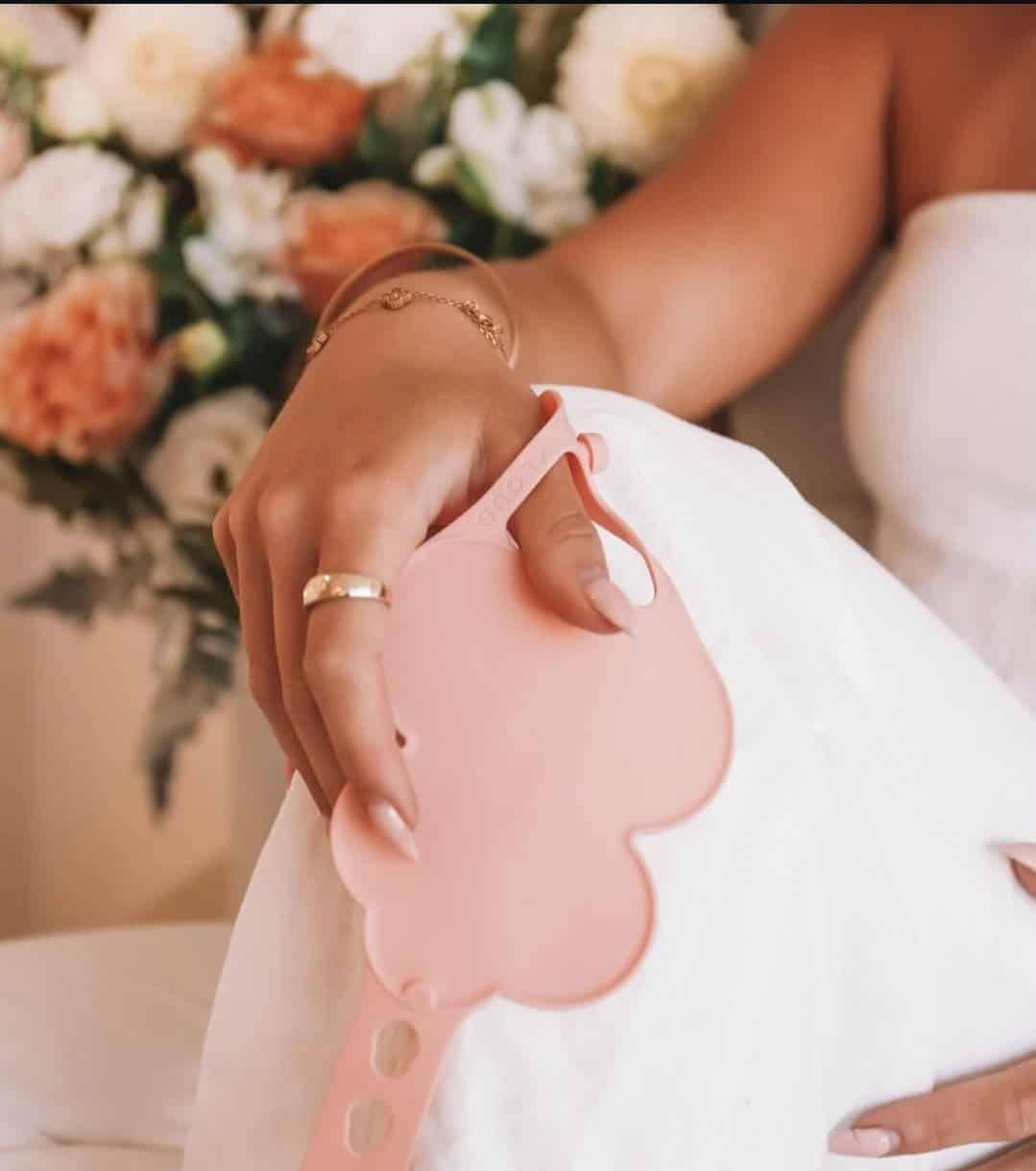 A woman in a white dress is holding a pink object — 3D Tech In Sancrox, NSW