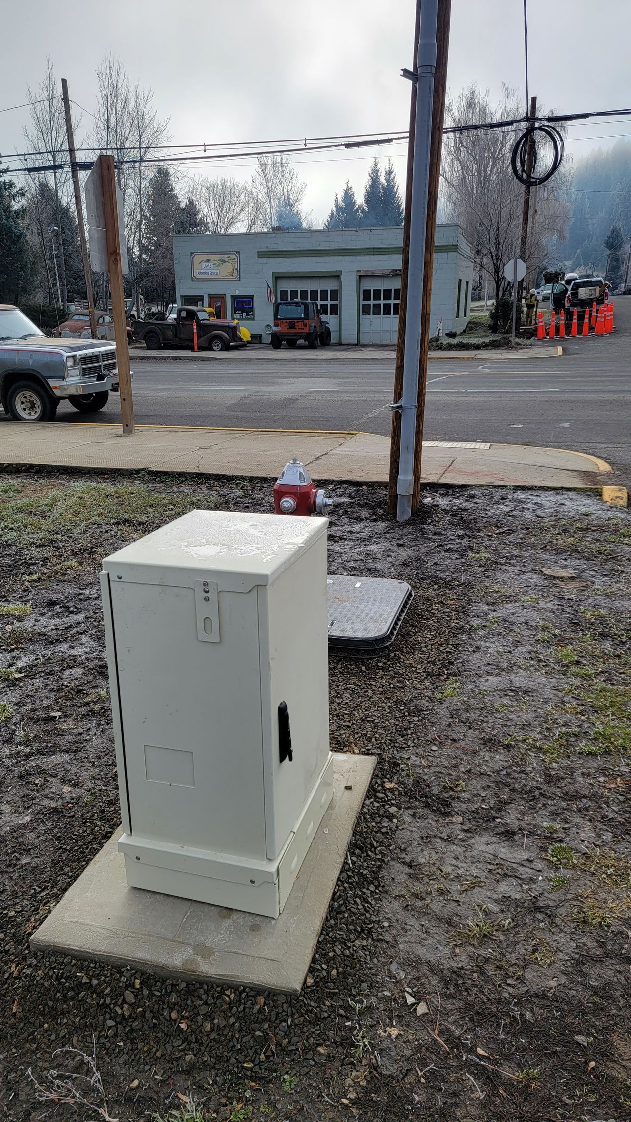Manning Cable Services workers inspecting and repairing telecommunications infrastructure after heavy snowfall in New Hampshire.