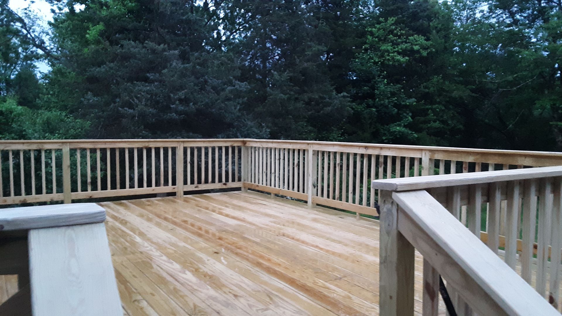 A wooden deck installation​ in Glastonbury CT - Exteriors of CT hard work