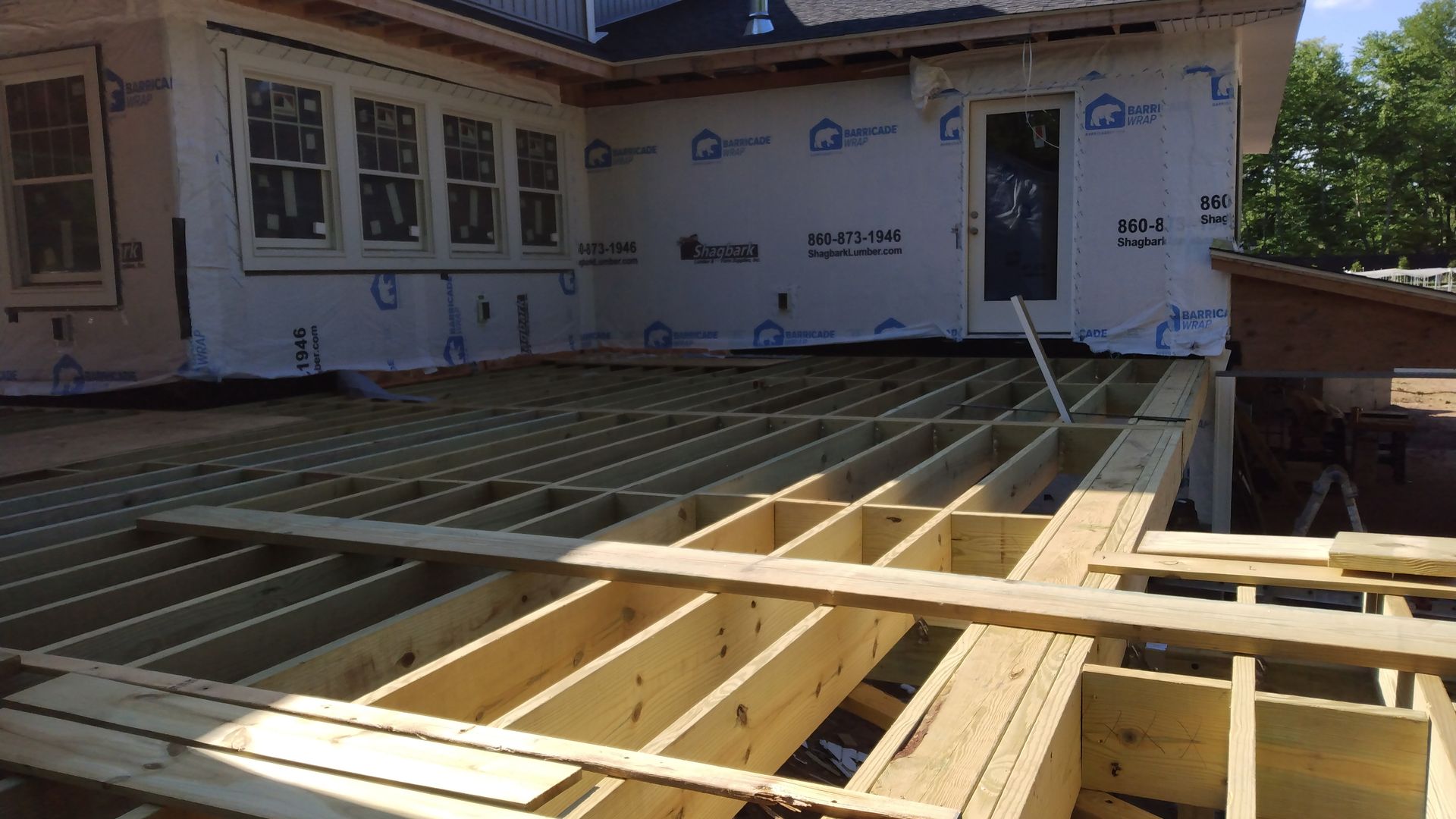 A wooden deck installation​ in Glastonbury CT in progress - Exteriors of CT hard at work