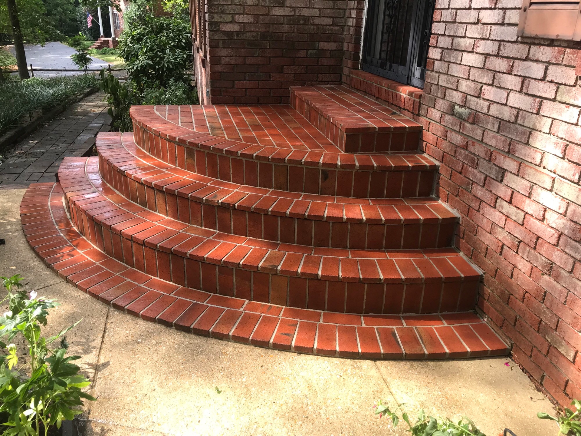 A set of brick steps leading up to a brick building.