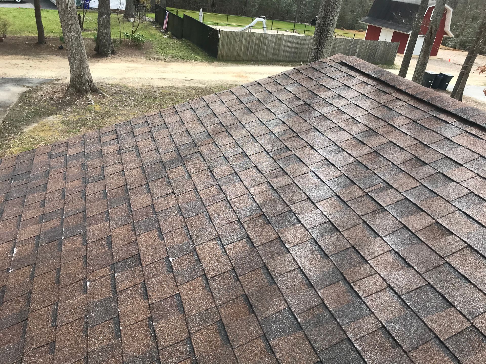 A close up of a roof with a lot of shingles on it.