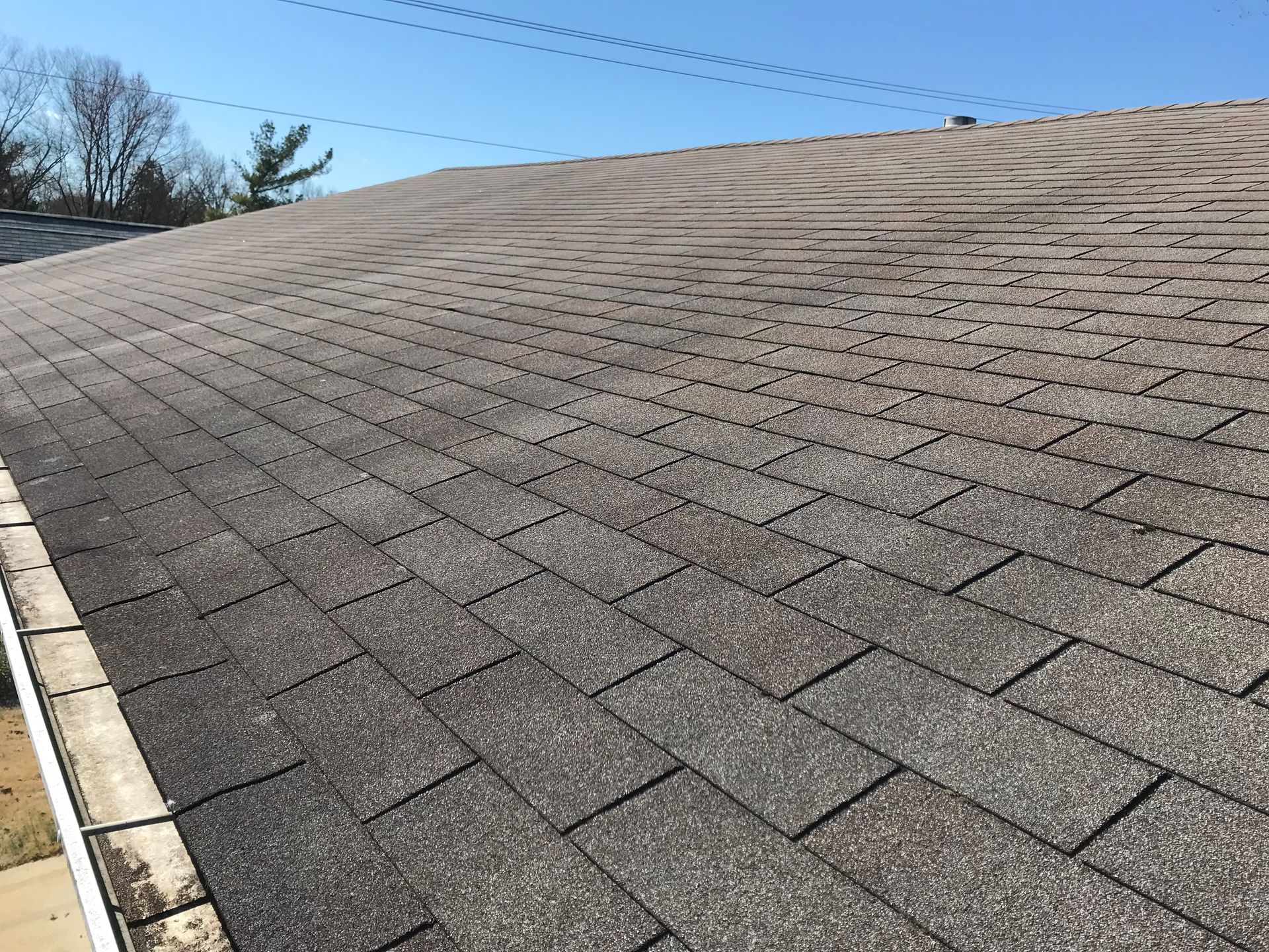 A close up of a roof with shingles on it.