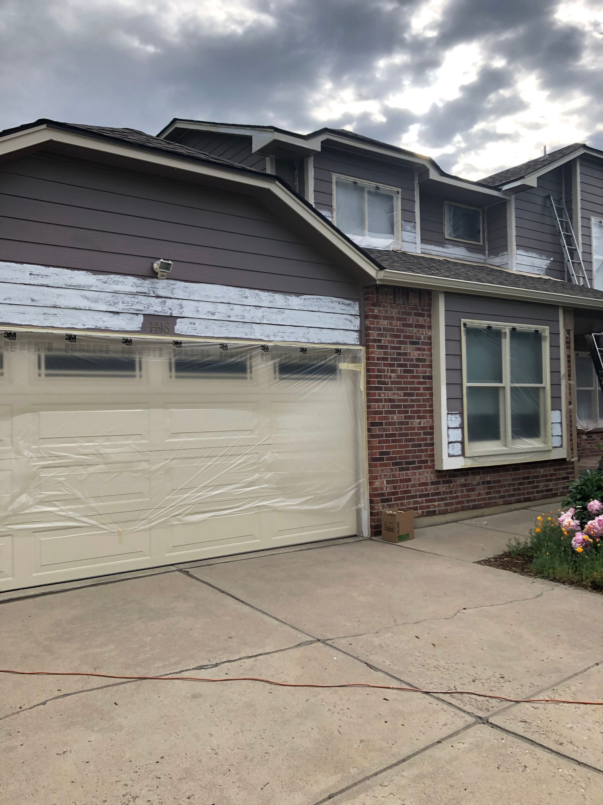 A House With A Garage Door Is Being Remodeled
