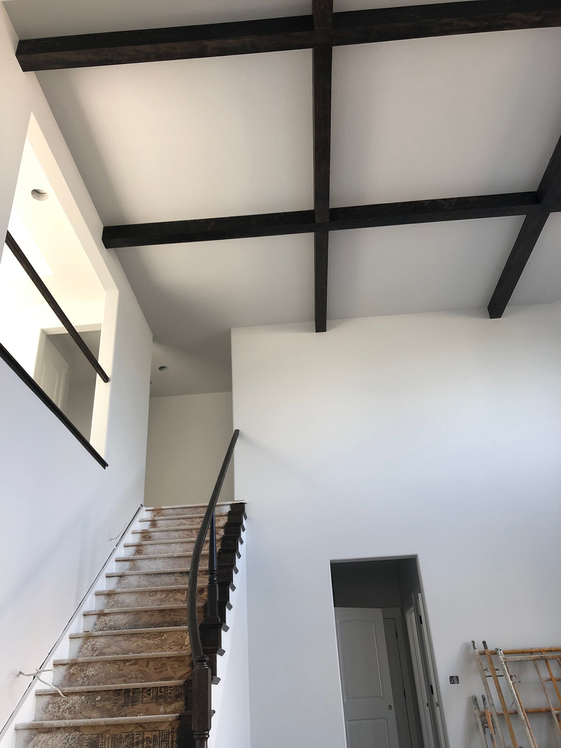 A Staircase Leading Up To The Second Floor Of A Building