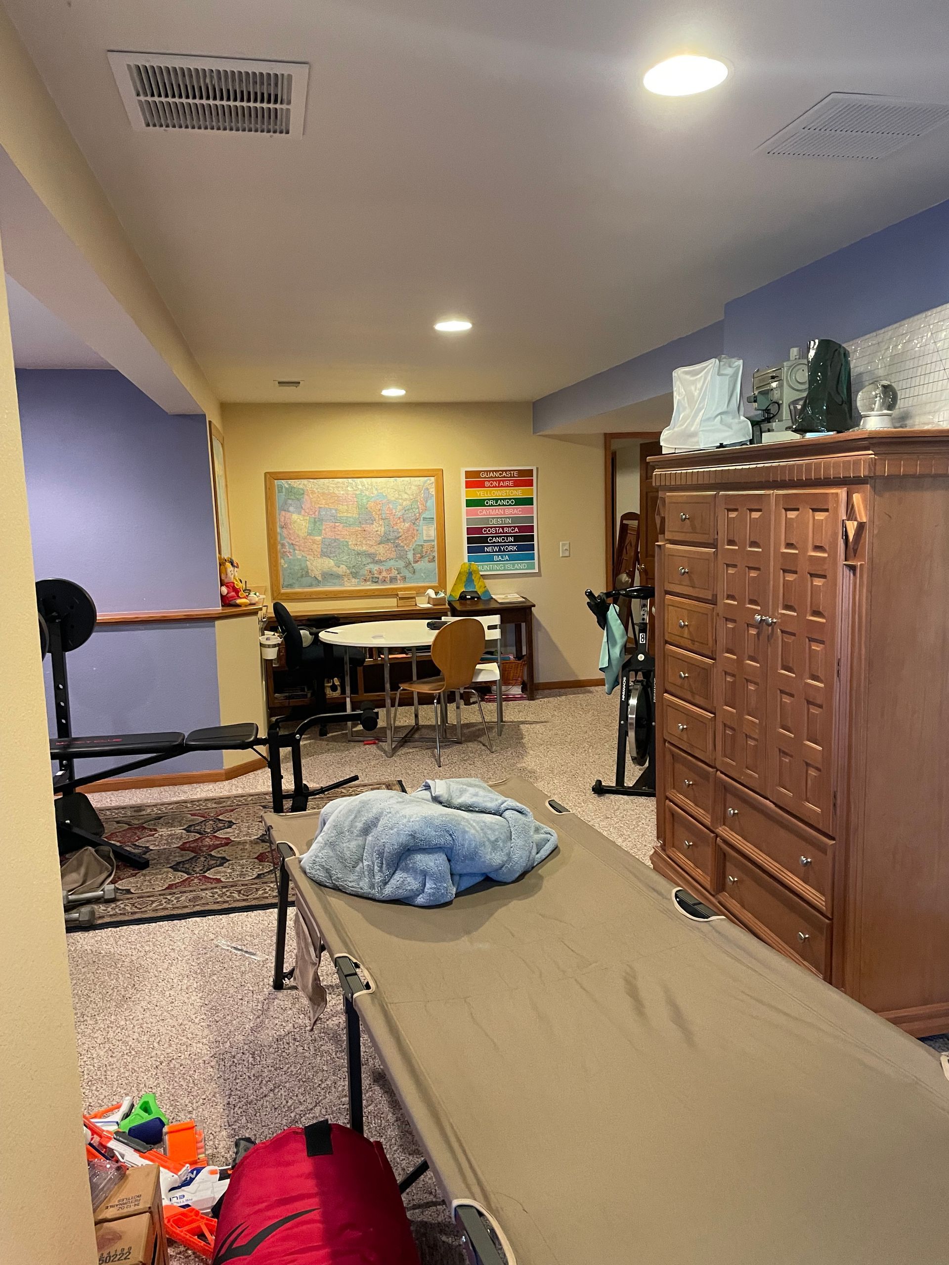 There Is A Bed In The Middle Of The Room In The Basement