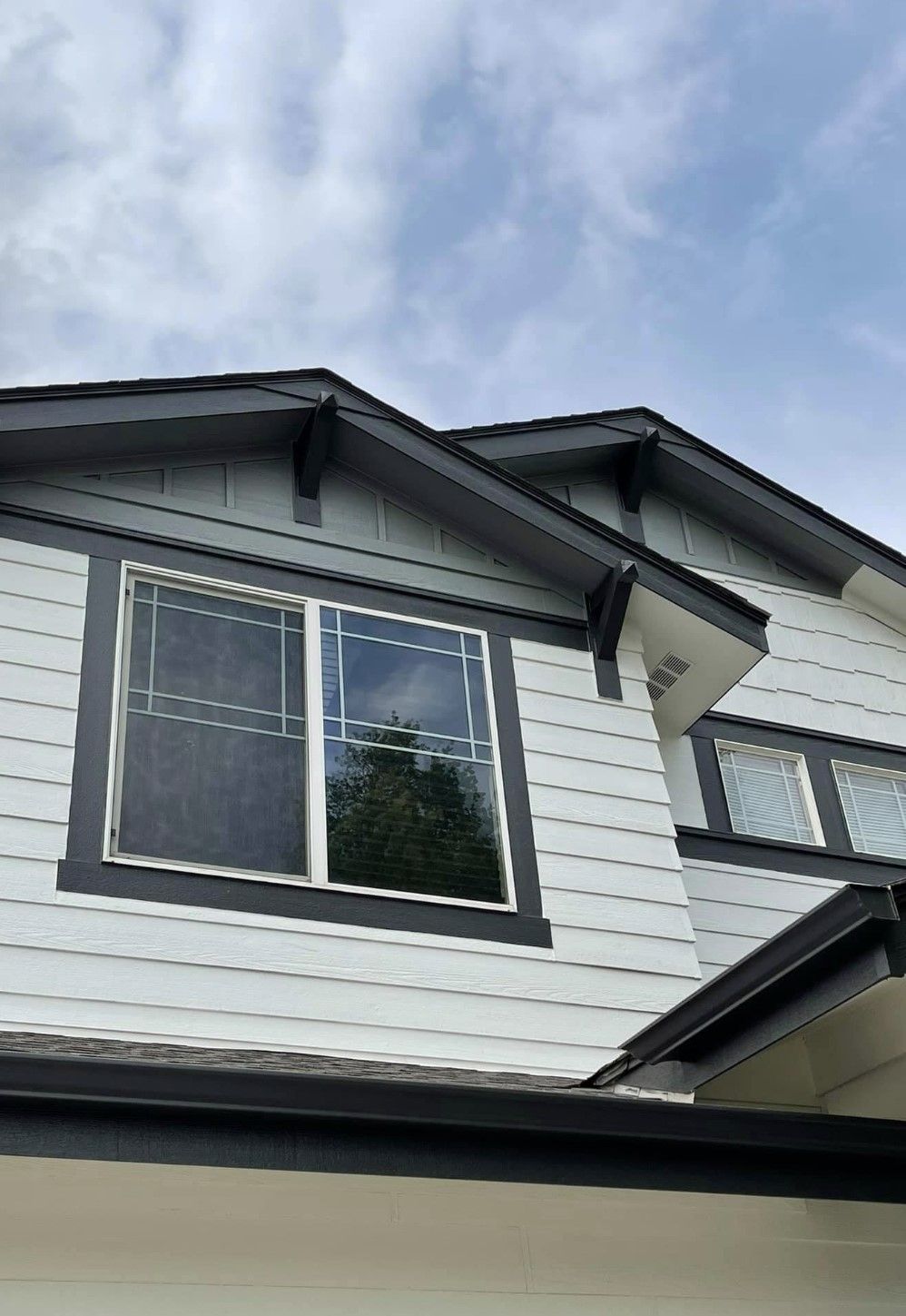 A House With A Lot Of Windows And A Blue Sky In The Background