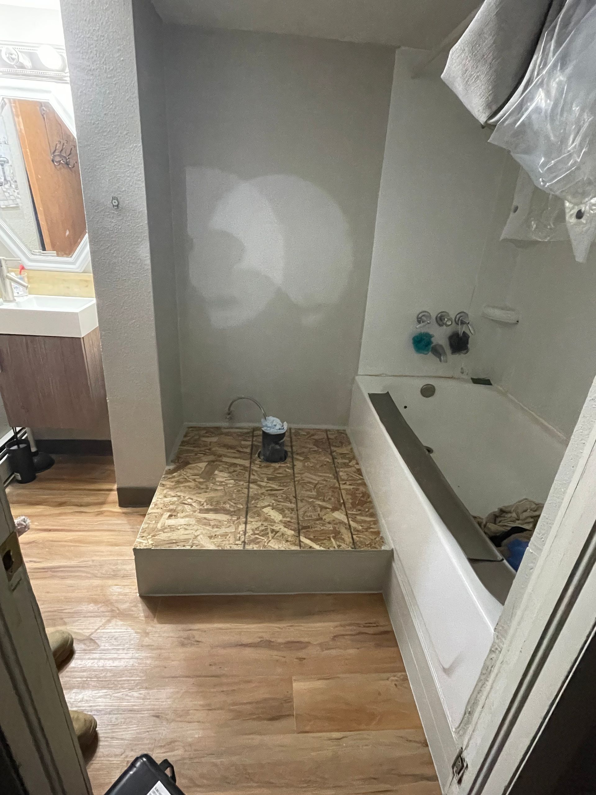 A Bathroom With A Bathtub And A Sink Being Remodeled
