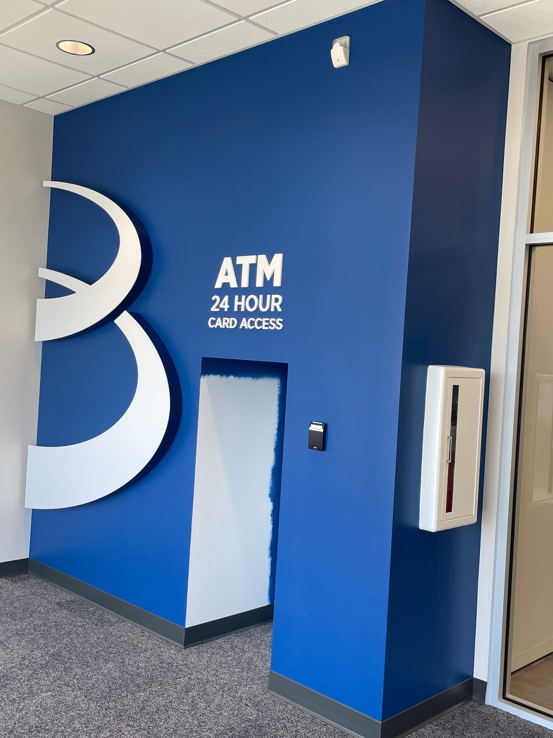 A Blue Wall With The Word Atm On It