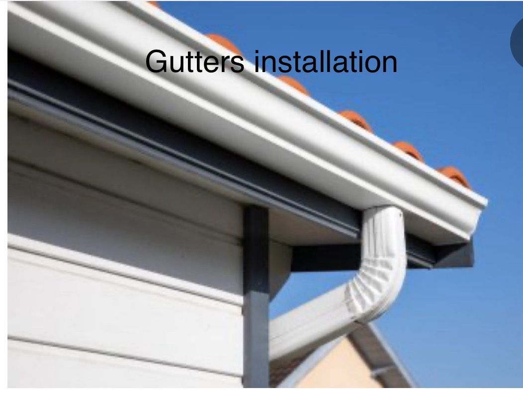 Gutters Are Being Installed On The Side Of A House