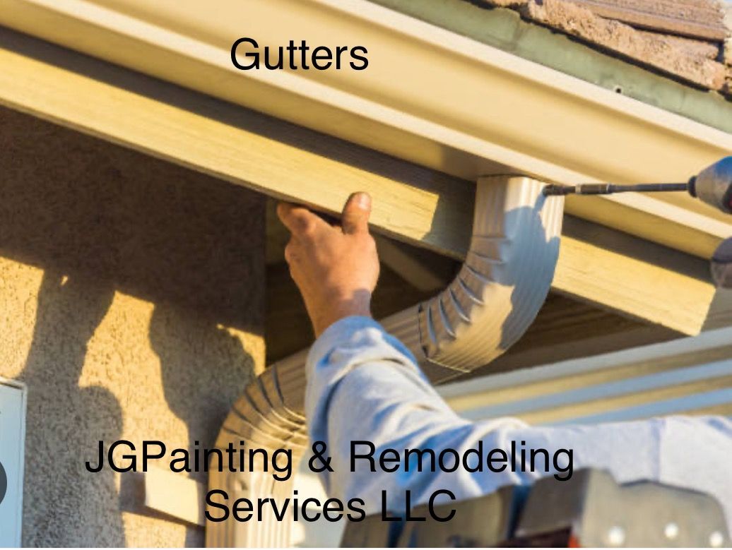 A Kitchen With White Cabinets , A Black Stove Top Oven , And A Microwave