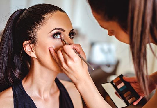 Woman having eyeliner — Makeup Salon in Appleton, WI