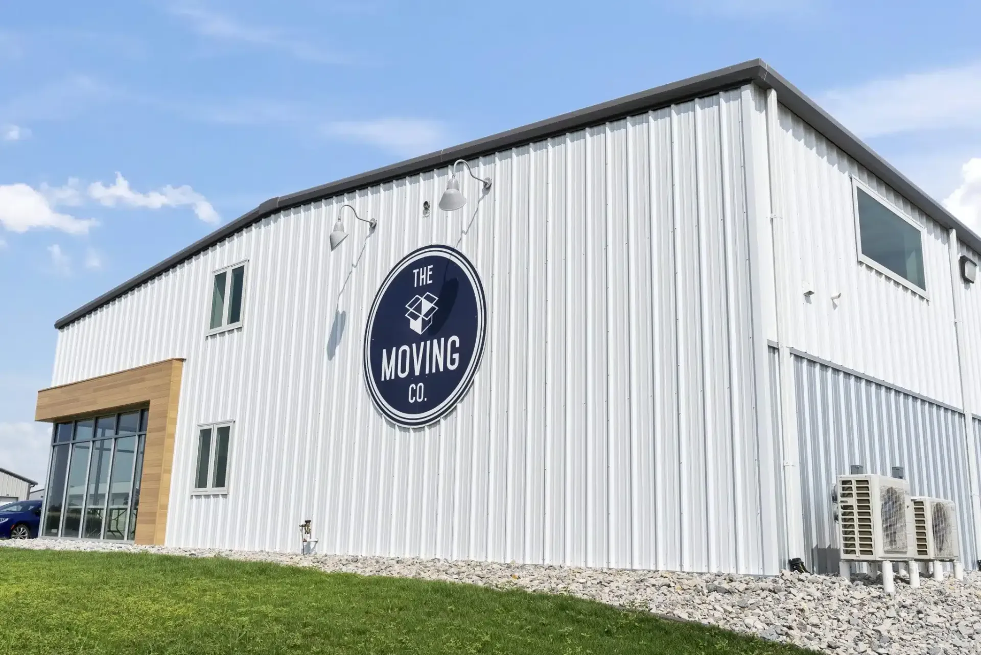 a large white building with a blue logo on the side of it .