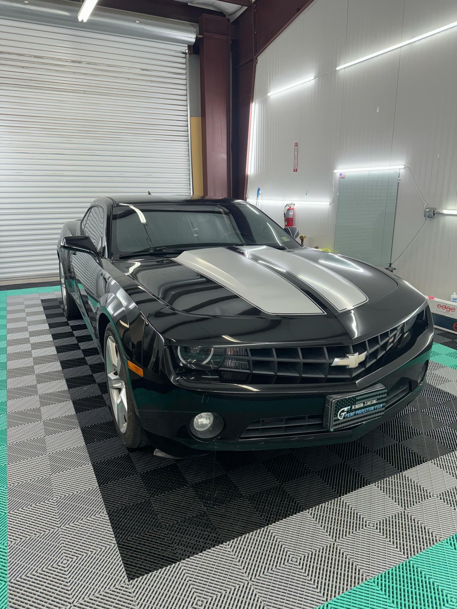 Car with front windshield tinting in progress, highlighting the benefits of UV protection and glare 