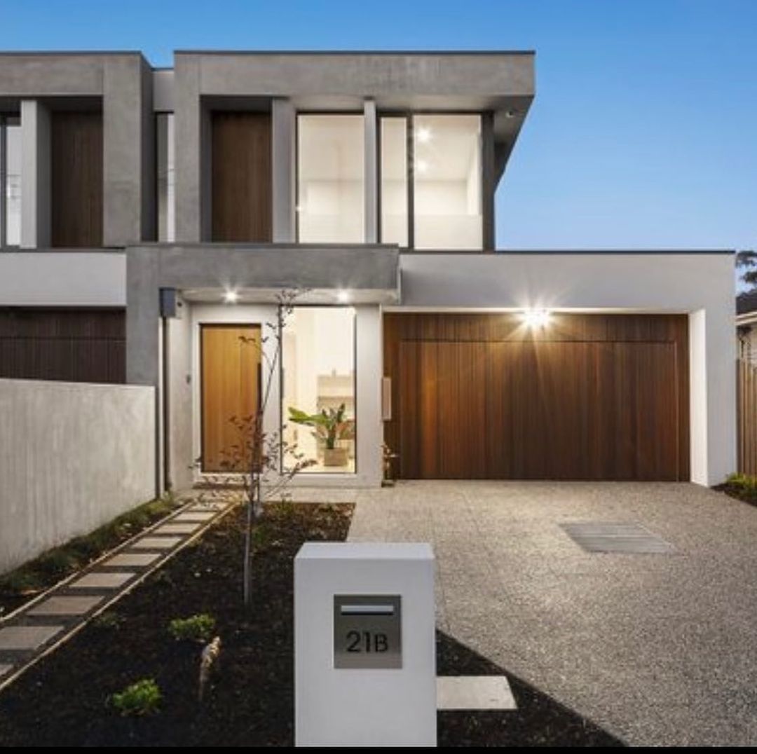 A modern house with a mailbox that says 216