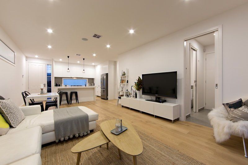 A living room filled with furniture and a flat screen tv.