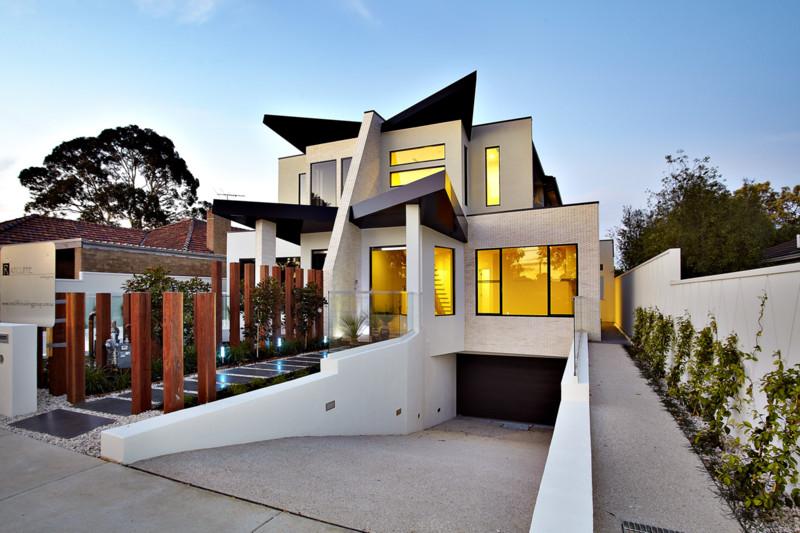 A large white house with a black roof