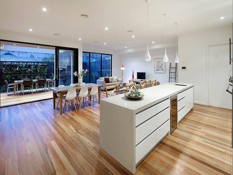 There is a large island in the middle of the kitchen.