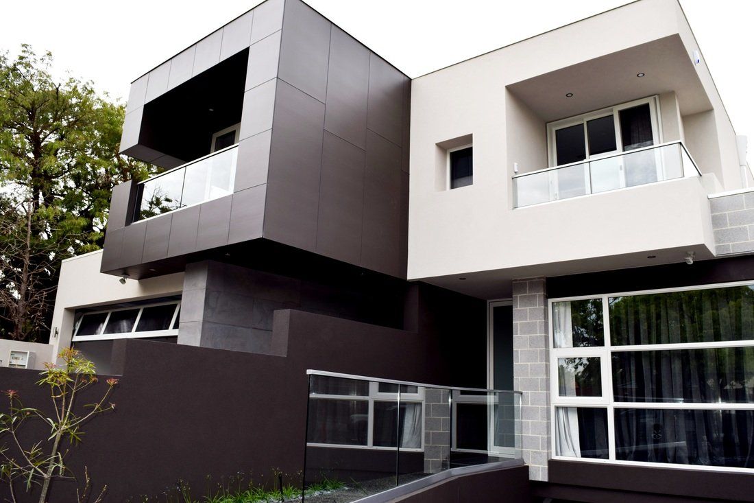 A large house with a lot of windows and balconies