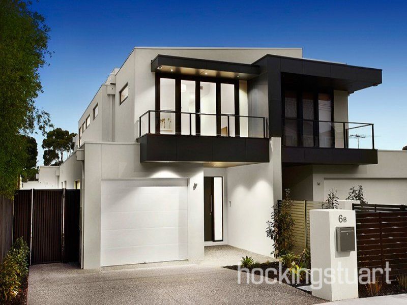 A modern house with the number 6a on the front