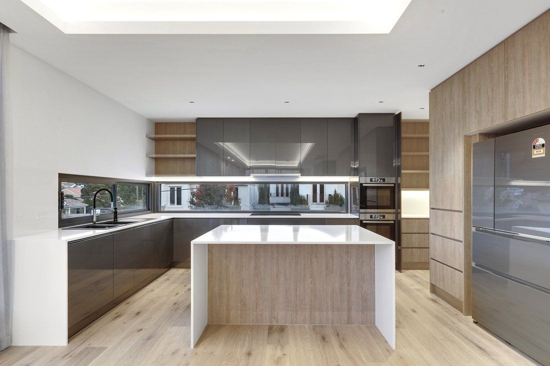 A kitchen with a large island in the middle of it