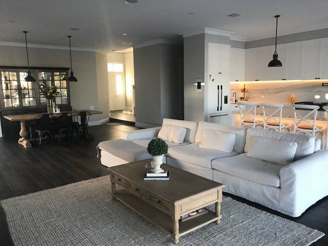 A living room with a white couch and a coffee table