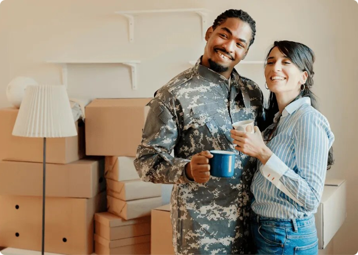 Las Vegas Veteran holding his partner unpacking boxes as they move into a new home