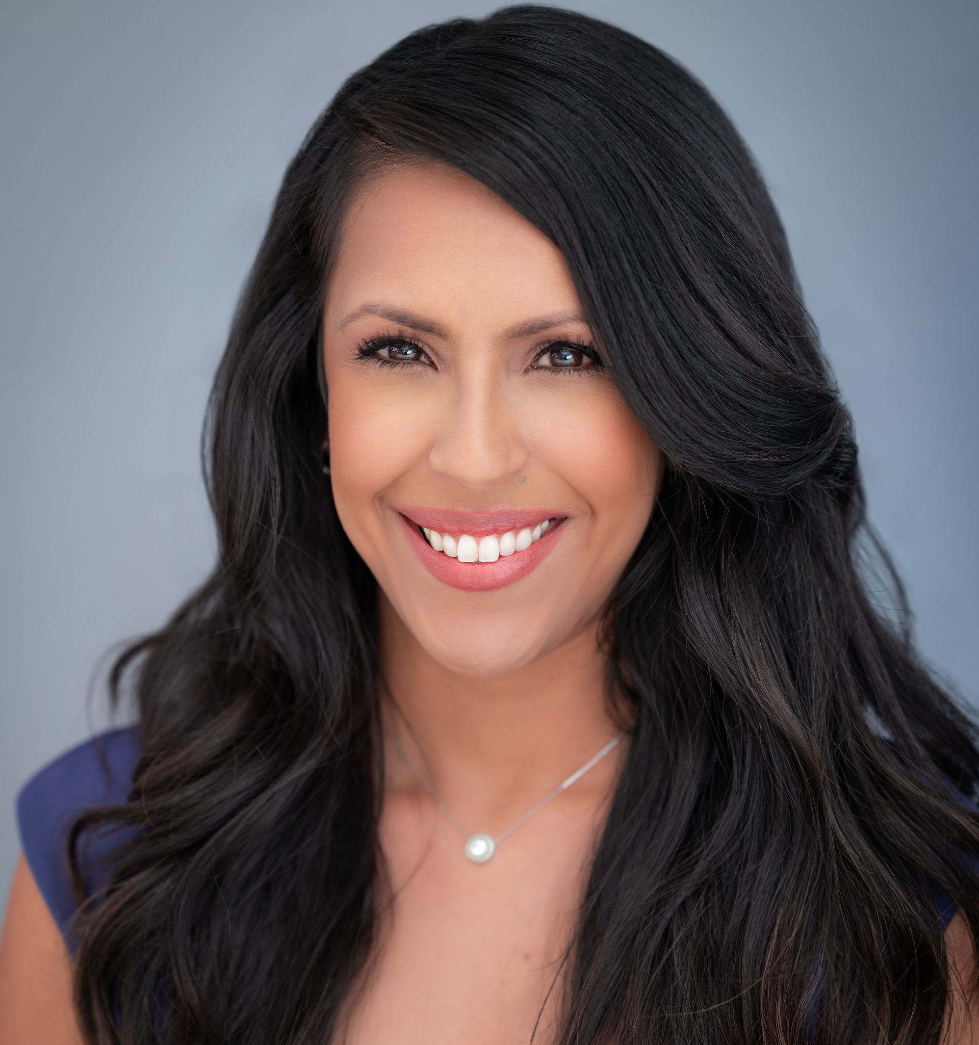 A blue and white icon representing fair housing  on a blue background.