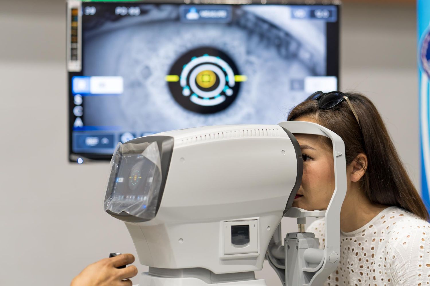 A woman is getting her eyes checked by an ophthalmologist.