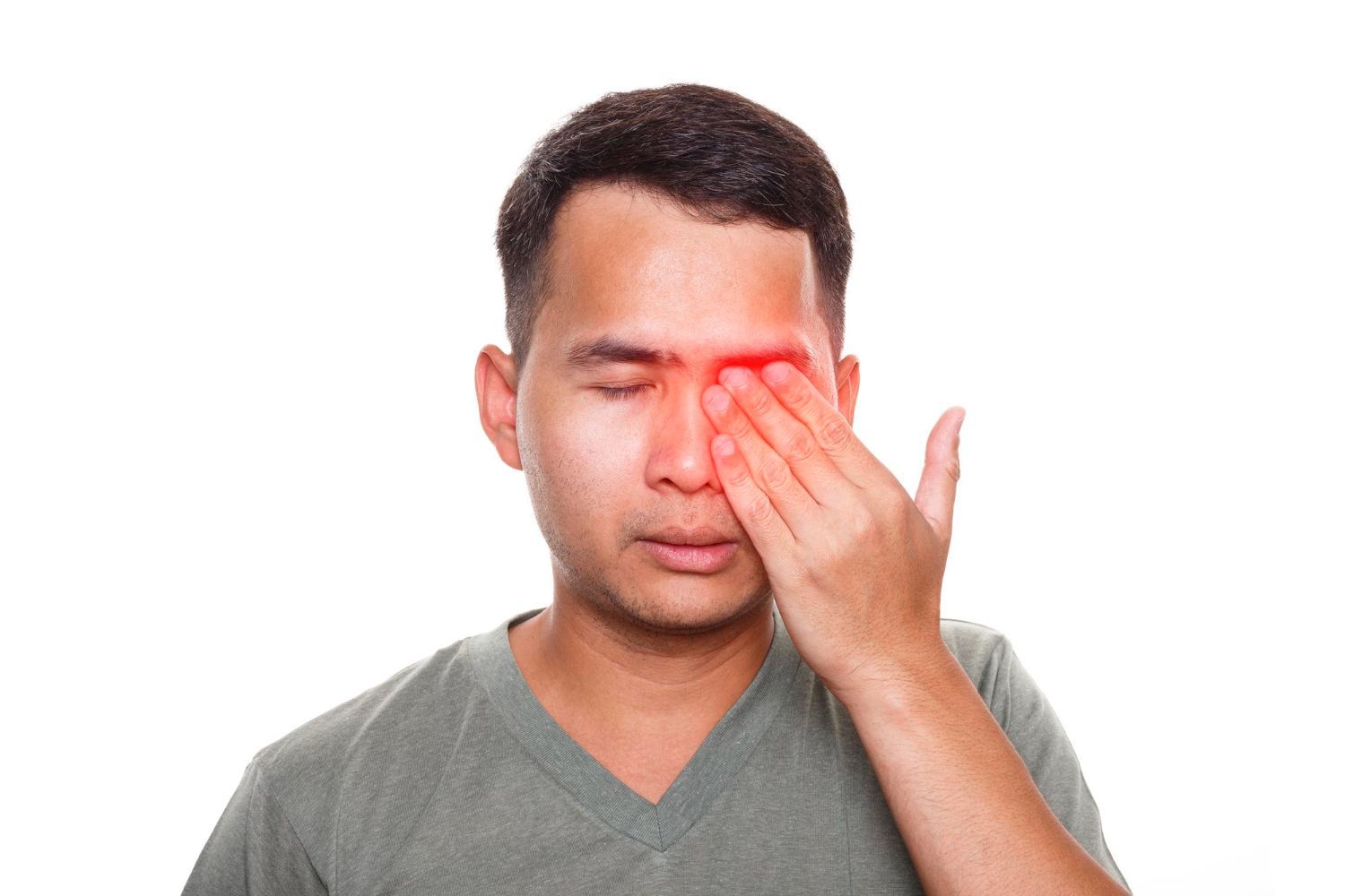 A man is rubbing his eyes because he has a headache.
