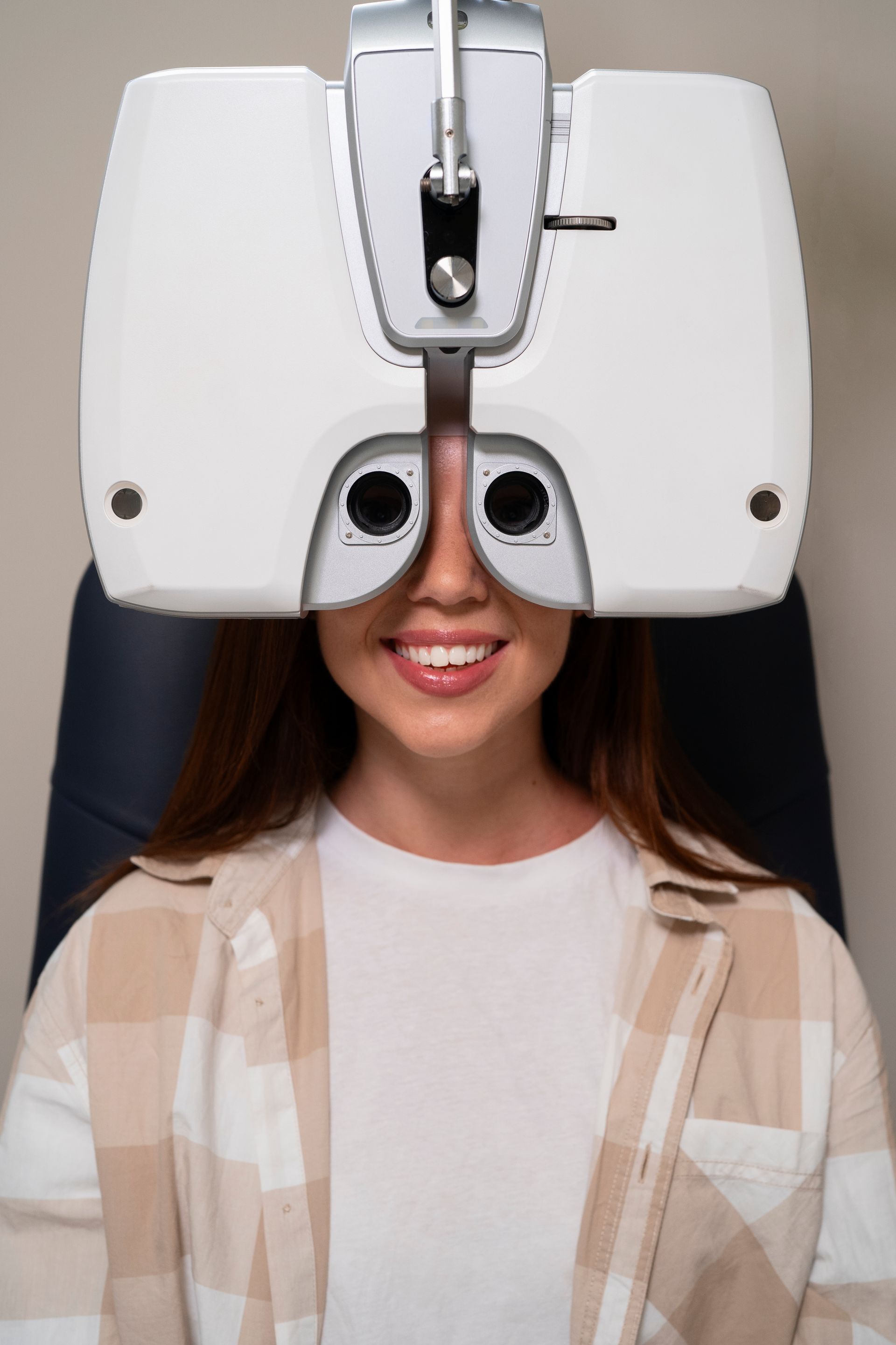 A woman is getting her eyes checked by an ophthalmologist.