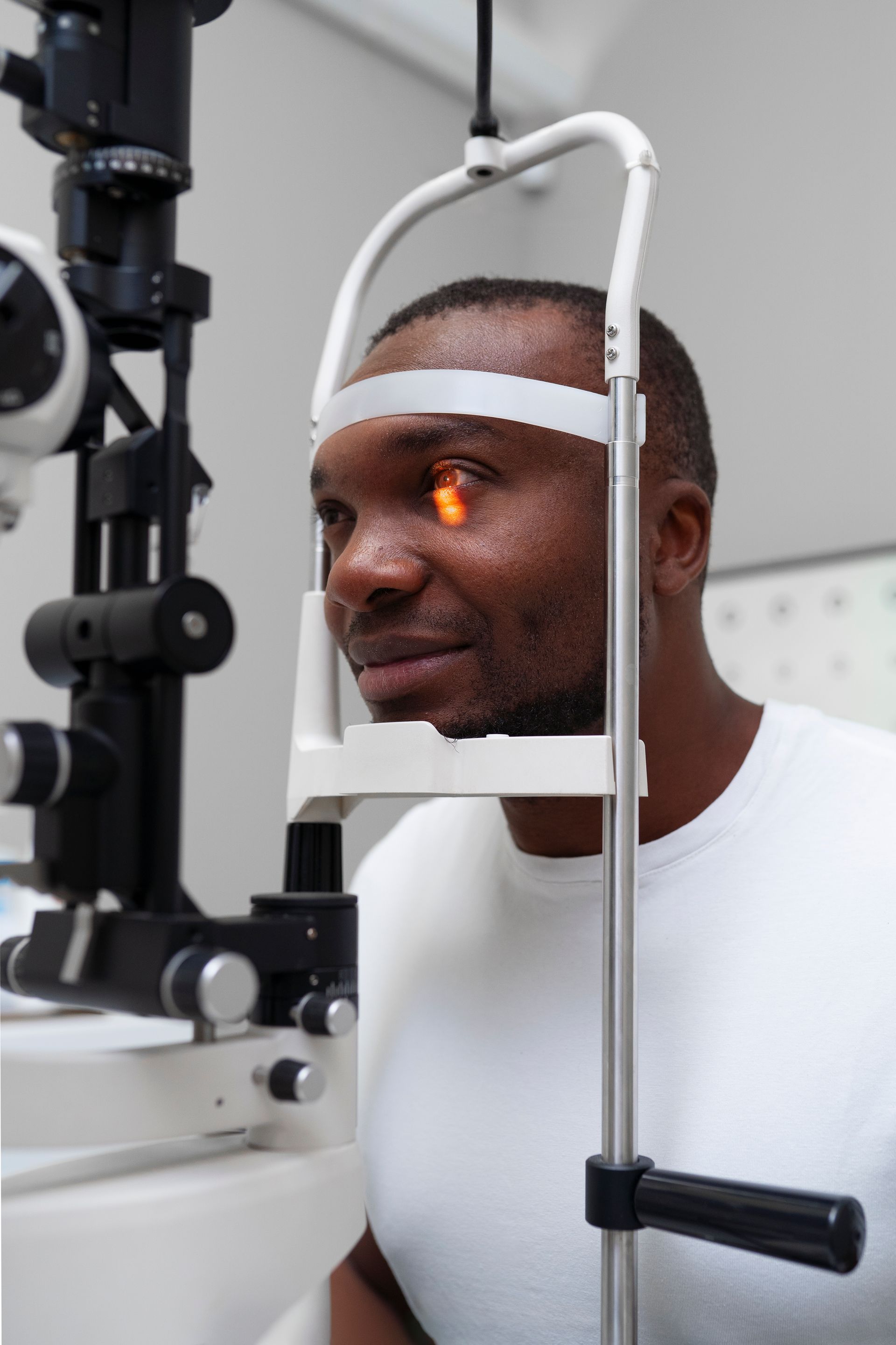 A man is getting his eyes examined by an ophthalmologist