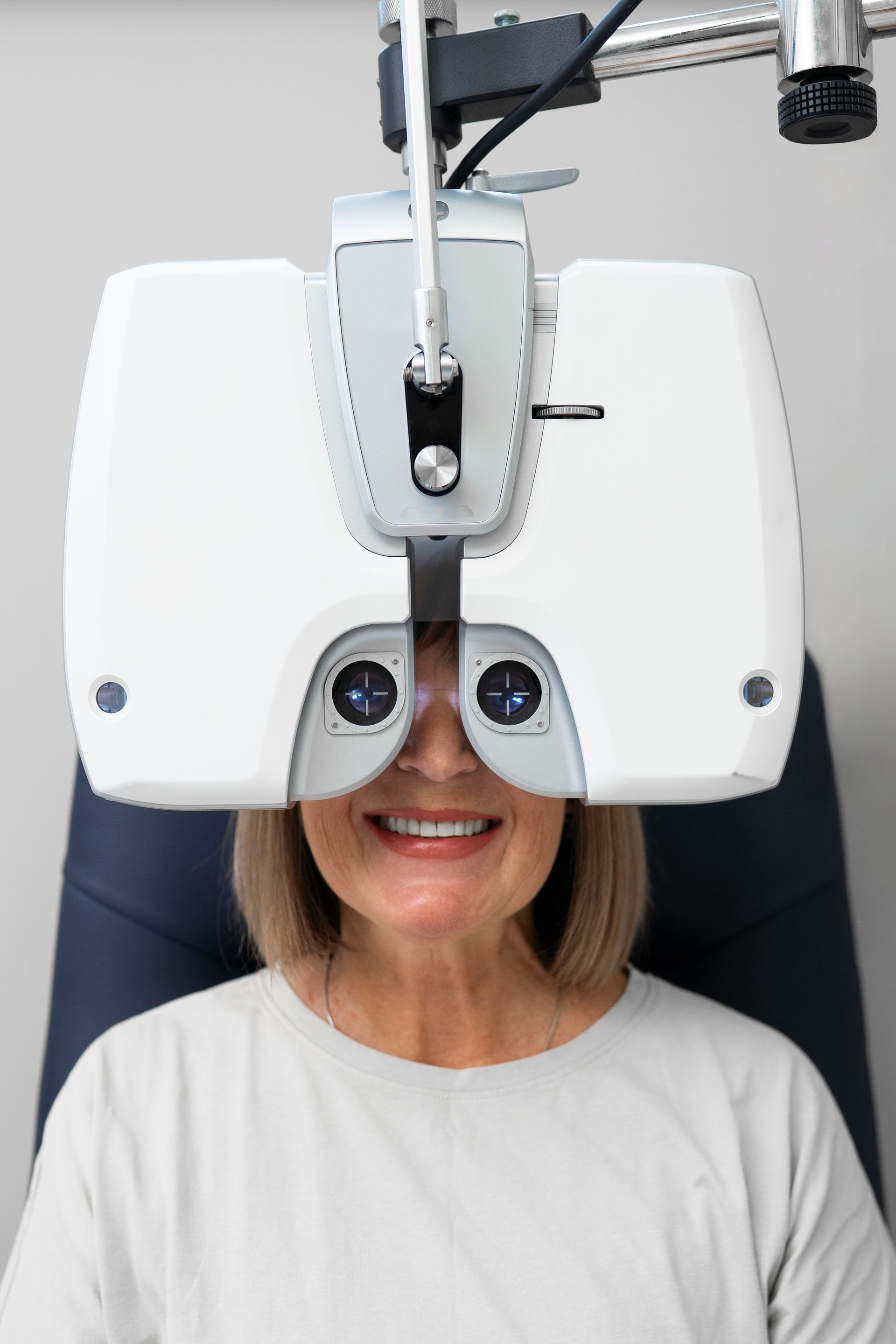 A woman is getting her eyes checked by an ophthalmologist.