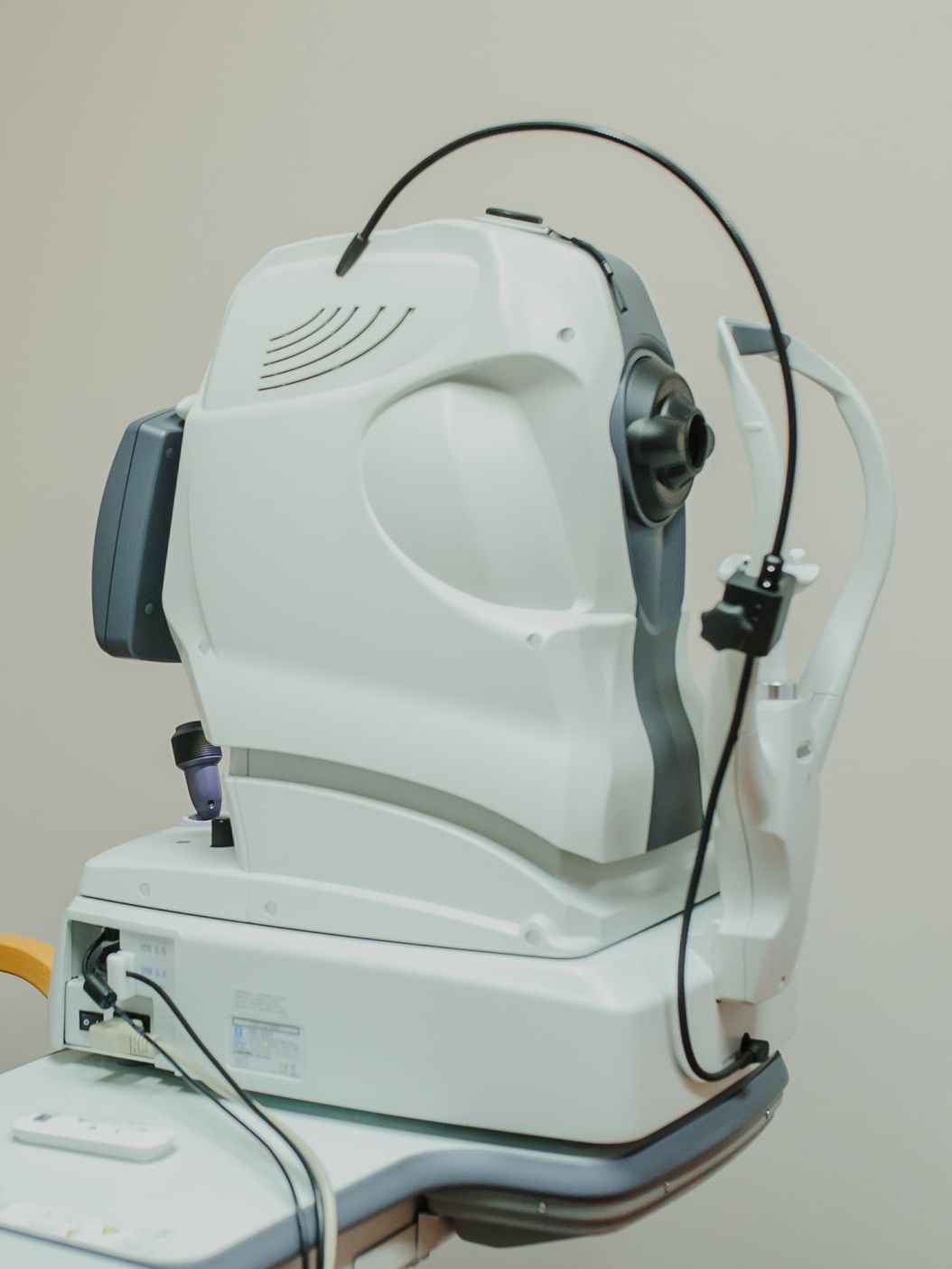 A white machine with headphones attached to it