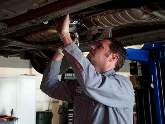 Land Rover Repair — Checking Car Engine Using Laptop in Modesto, CA
